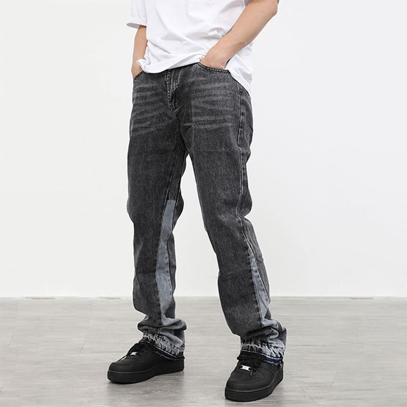 front full body model shot 100% cotton flare denim jeans, charcoal stone rinse whiskers, side contrast panel, layered raw frayed hem