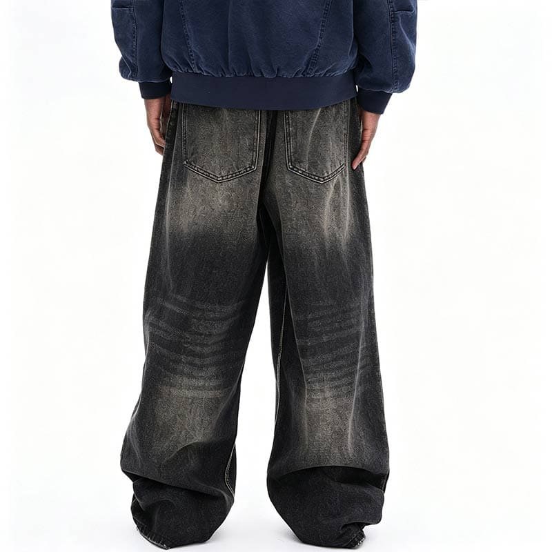 back view of heavy wash relaxed fitting denim pants, gradient tonal wash and back pocket stitching
