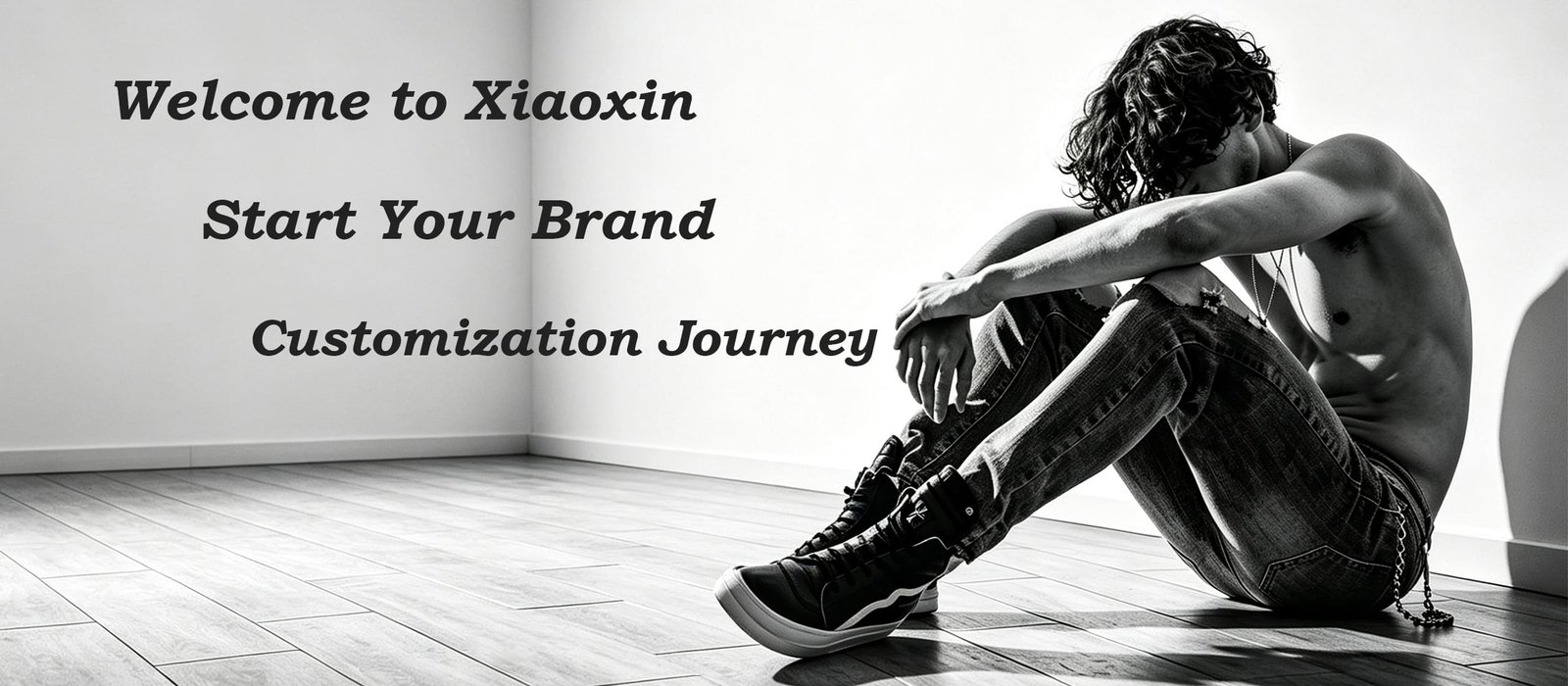 xiaoxin clothing custom garment manufacturing factory, focusing on denim OEM jeans and ODM service, black white homepage banner with male model in denim jeans